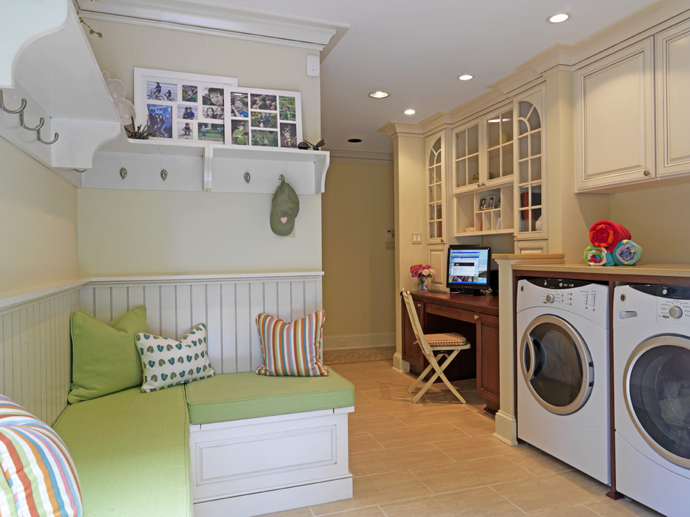 Design ideas for a traditional utility room in DC Metro with beige cabinets and a side-by-side washer and dryer.