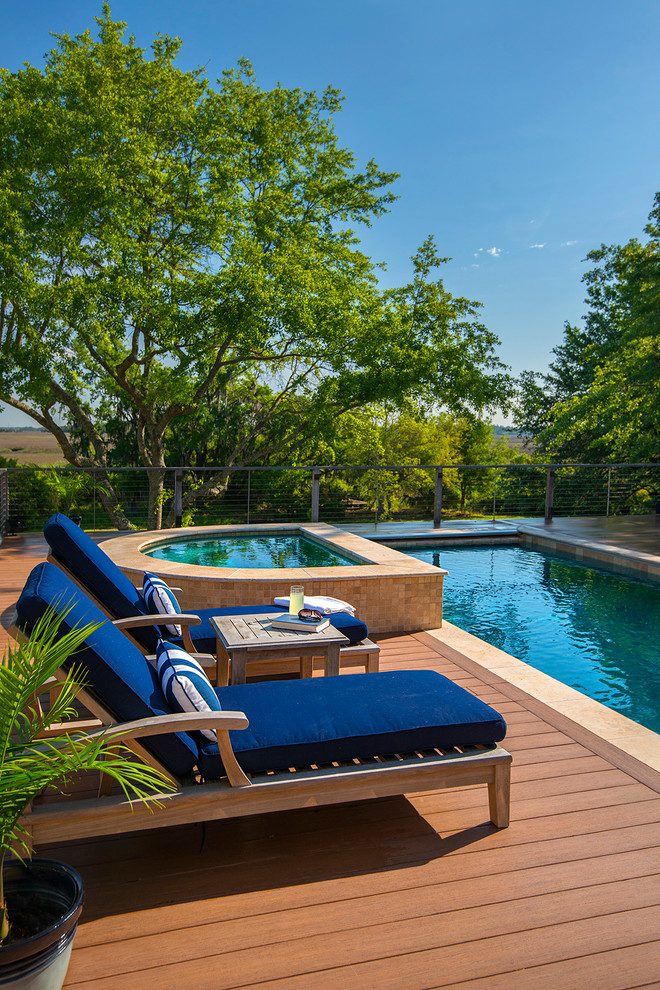 Inspiration for a mid-sized contemporary backyard rectangular pool in Charleston with decking.