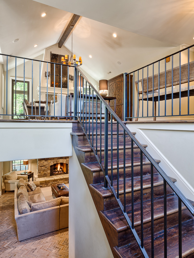 Design ideas for a mid-sized traditional wood u-shaped staircase in Other with wood risers and metal railing.
