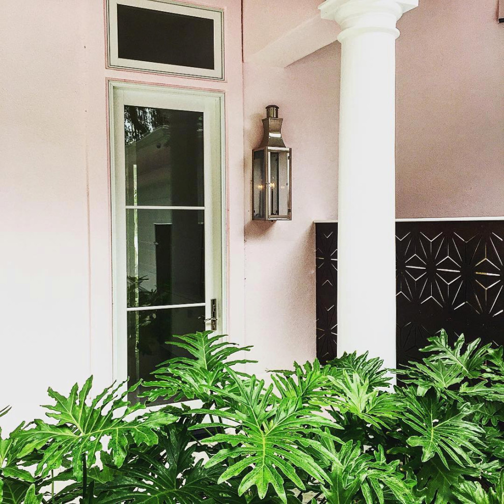 Inspiration for a contemporary stucco pink exterior in New Orleans.
