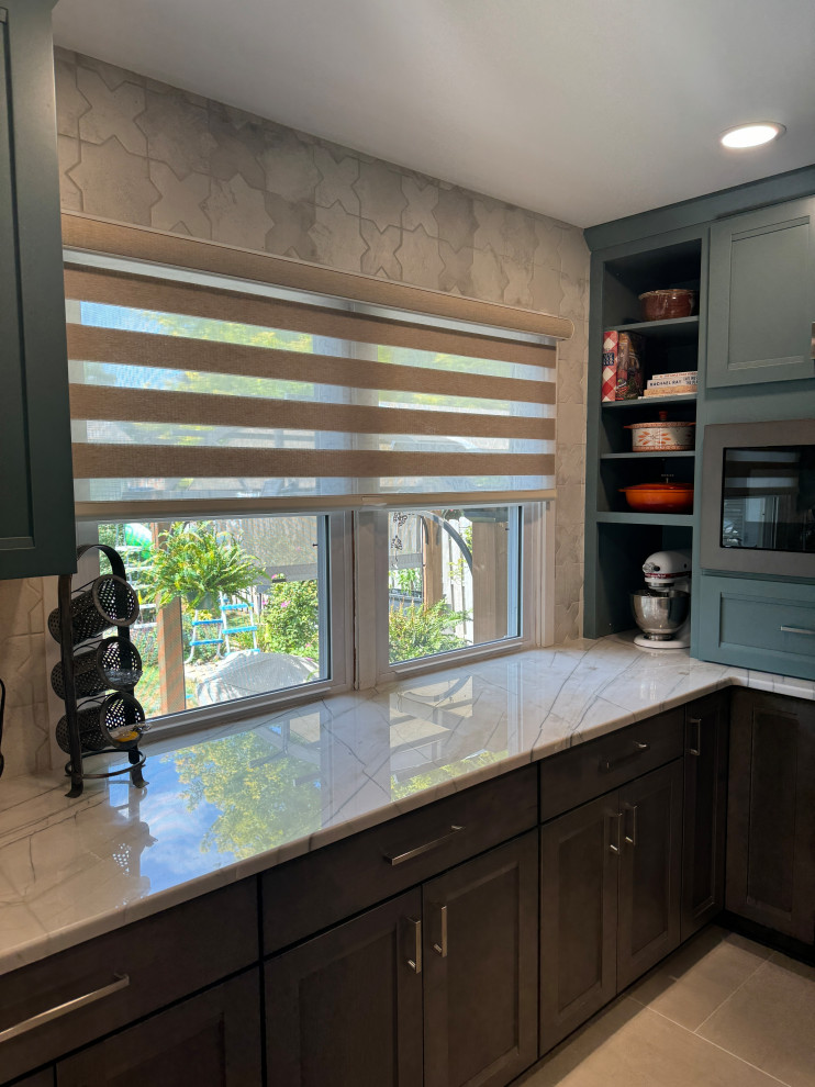 Inspiration for a large transitional galley porcelain tile and beige floor eat-in kitchen remodel in Omaha with a double-bowl sink, recessed-panel cabinets, turquoise cabinets, quartzite countertops, white backsplash, porcelain backsplash, stainless steel appliances, no island and white countertops