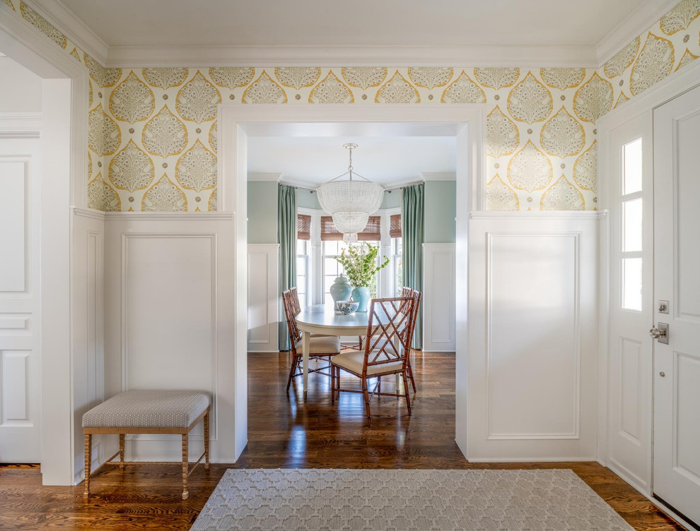 Inspiration for a mid-sized traditional entry hall in Minneapolis with carpet, white walls, a single front door, a white front door and brown floor.