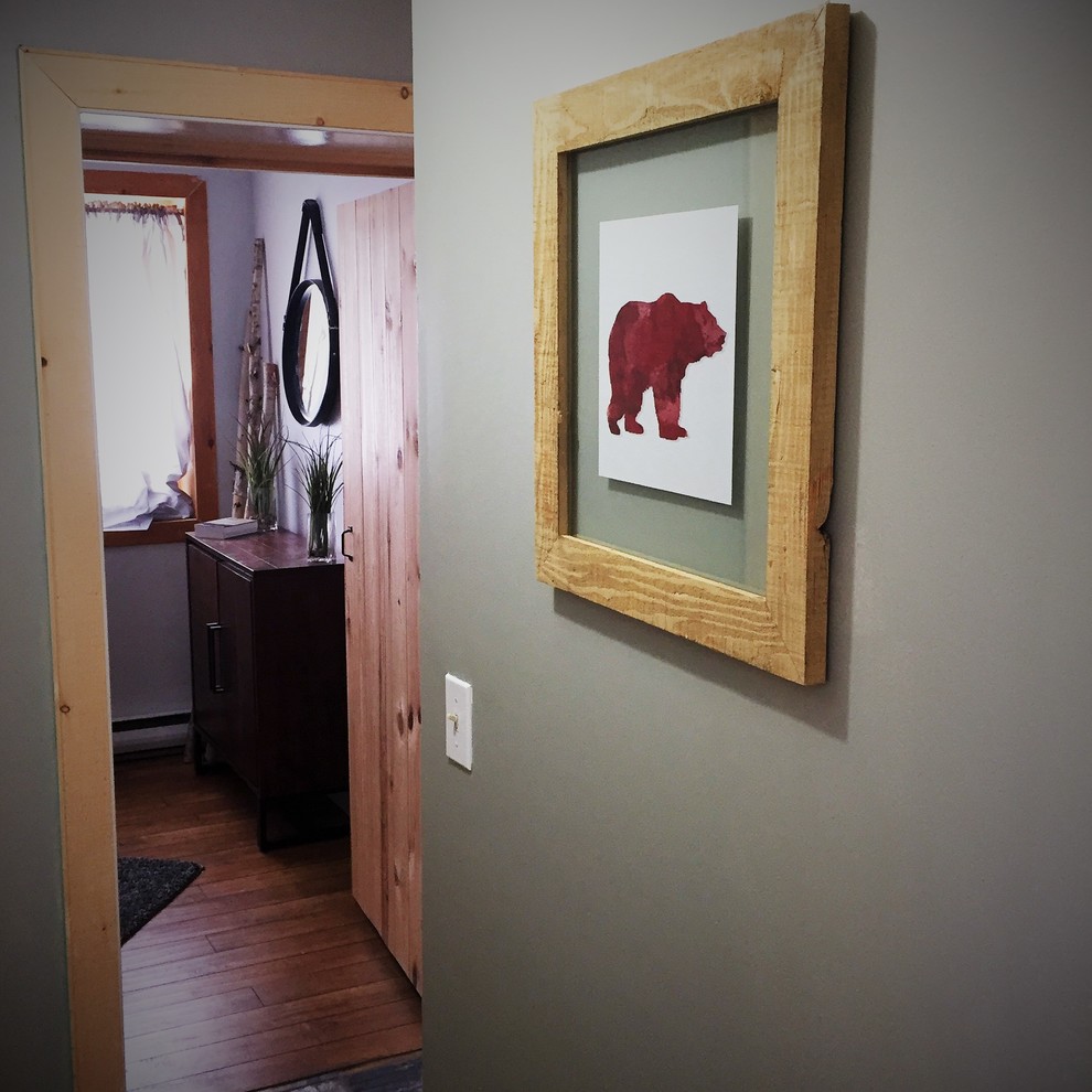 Mid-sized mountain style medium tone wood floor hallway photo in Toronto with gray walls