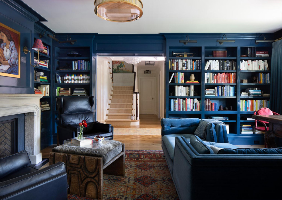 Comfortable and Collected - The family living in this shingled roofed home on the Peninsula loves color and pattern. At the heart of the two-story house, we created a library with high gloss lapis blue walls. The tête-à-tête provides an inviting place for the couple to read while their children play games at the antique card table. As a counterpoint, the open planned family, dining room, and kitchen have white walls. We selected a deep aubergine for the kitchen cabinetry. In the tranquil master suite, we layered celadon and sky blue while the daughters' room features pink, purple, and citrine.