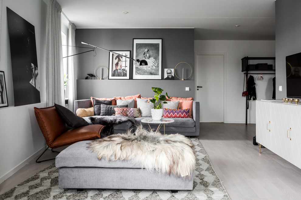 Mid-sized scandinavian formal enclosed living room in Stockholm with grey walls, marble floors and no tv.