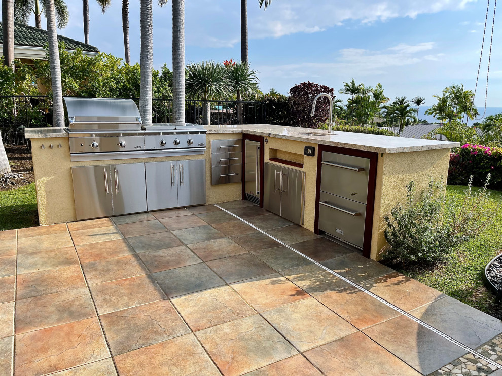 Inspiration for a medium sized nautical back ground level terrace in Hawaii with an outdoor kitchen and no cover.