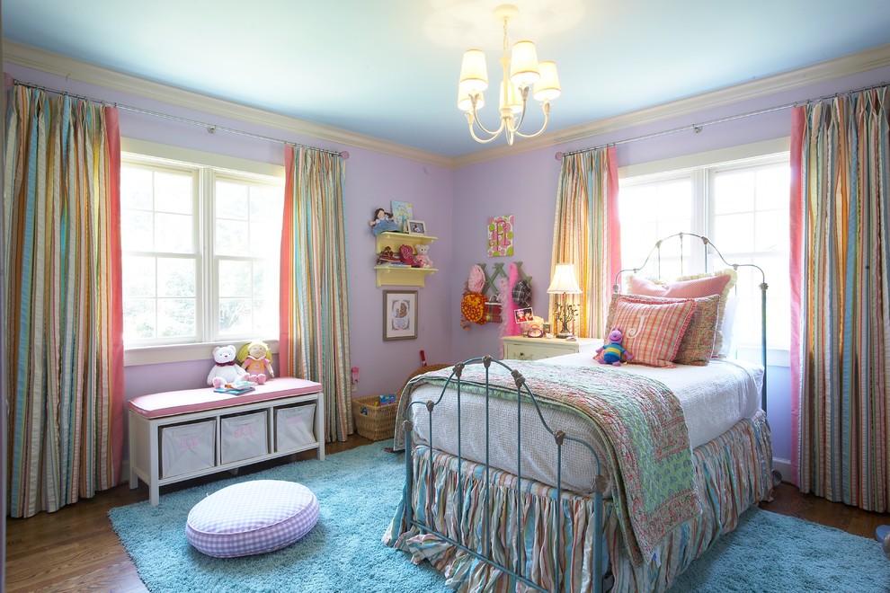 Inspiration for a traditional kids' bedroom for kids 4-10 years old and girls in Birmingham with purple walls and dark hardwood floors.