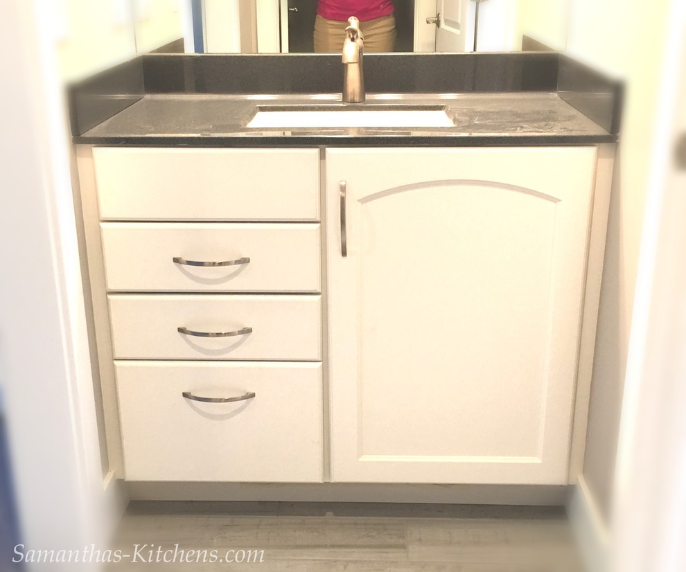 Example of a mid-sized transitional kids' porcelain tile home design design with recessed-panel cabinets, white cabinets, beige walls, an integrated sink and marble countertops