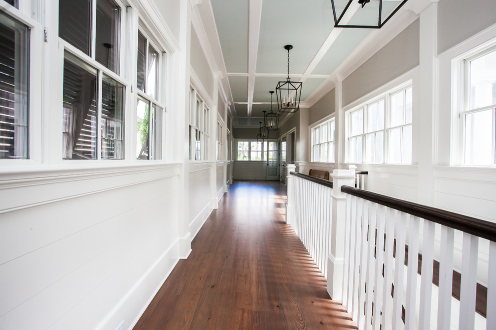 Design ideas for a beach style hallway in Charleston with medium hardwood floors.