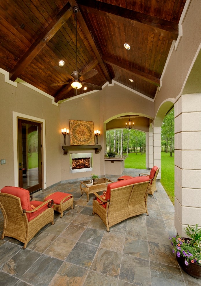 Design ideas for a mediterranean patio in Houston with a fire feature.
