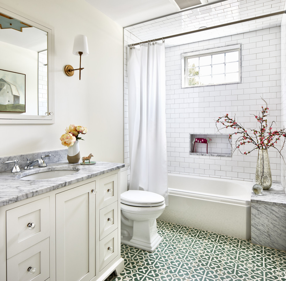 Heart of Hoboken Family Residence - Alcove bathtub - small transitional white tile and subway tile ceramic tile and green floor alcove bathtub idea in Los Angeles with shaker cabinets, white cabinets, a two-piece toilet, white walls, an undermount sink, marble countertops and gray countertops