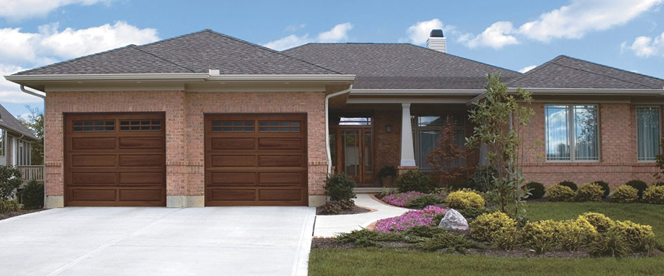 Mid-sized traditional attached two-car garage in Other.