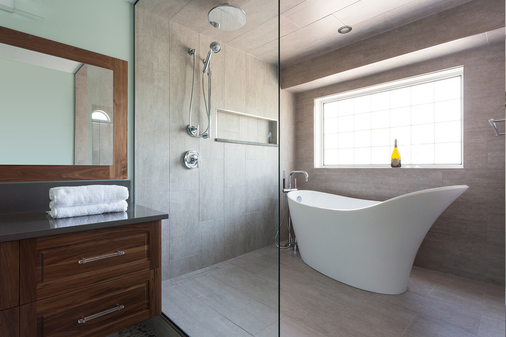 Design ideas for a large contemporary master bathroom in Other with an undermount sink, medium wood cabinets, a freestanding tub, an open shower, beige tile, raised-panel cabinets, porcelain tile, green walls, porcelain floors and solid surface benchtops.
