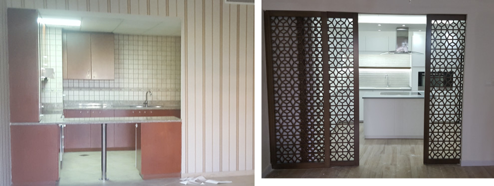Large minimalist l-shaped ceramic tile kitchen pantry photo with an integrated sink, flat-panel cabinets, white cabinets, ceramic backsplash, black appliances and an island