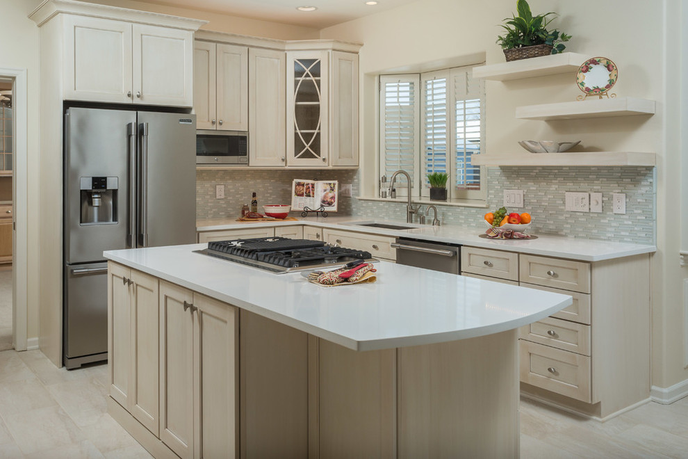 Mid-sized transitional l-shaped eat-in kitchen photo with recessed-panel cabinets, beige cabinets, gray backsplash and an island