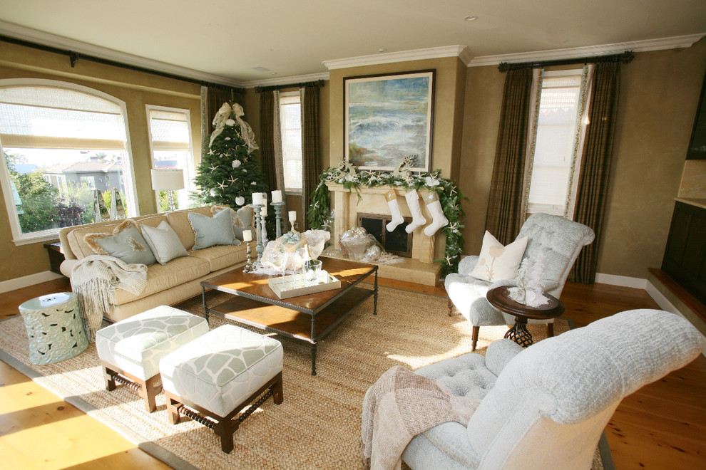 Large traditional living room in Los Angeles with beige walls and a standard fireplace.