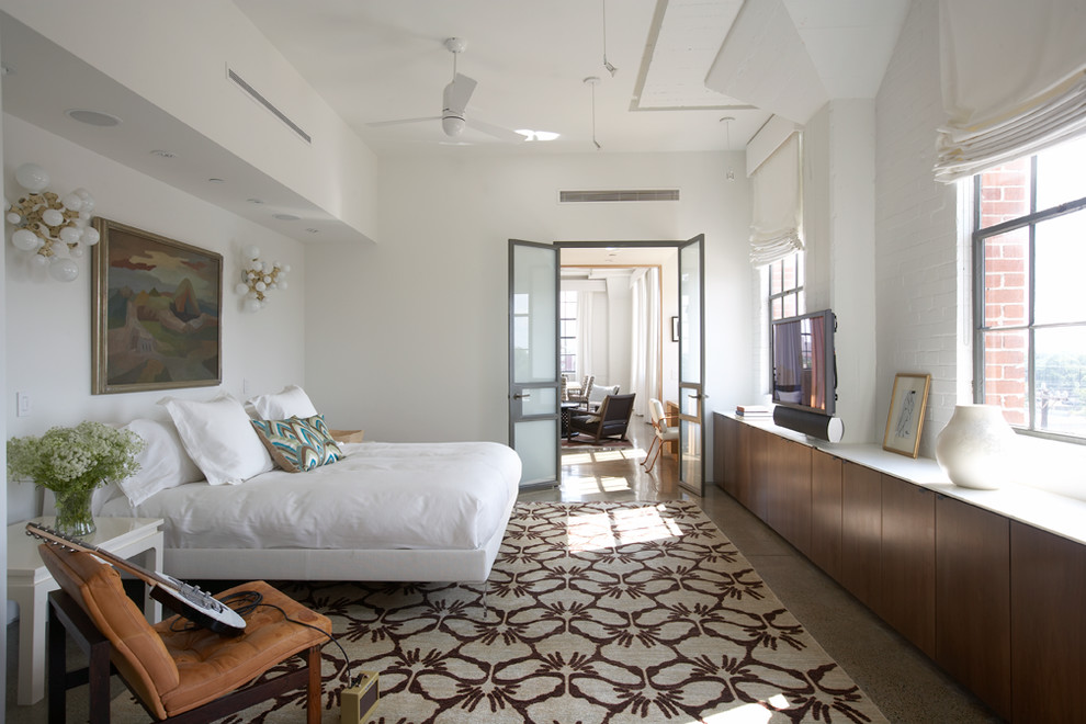 Example of a trendy bedroom design in Austin with white walls