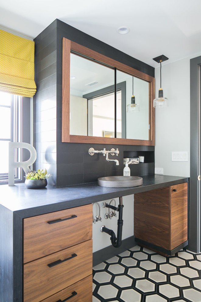 Powder room - coastal gray tile mosaic tile floor and gray floor powder room idea in Orange County with flat-panel cabinets, medium tone wood cabinets, gray walls, a vessel sink and gray countertops