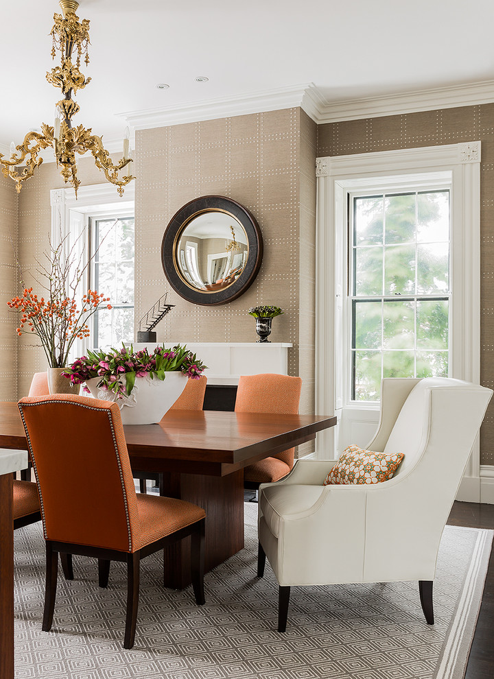 Design ideas for a mid-sized transitional dining room in Boston with beige walls, dark hardwood floors and a standard fireplace.