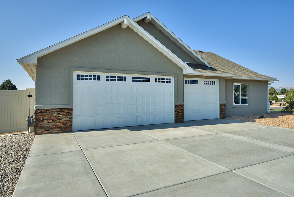 This is an example of a large arts and crafts garage in Other.