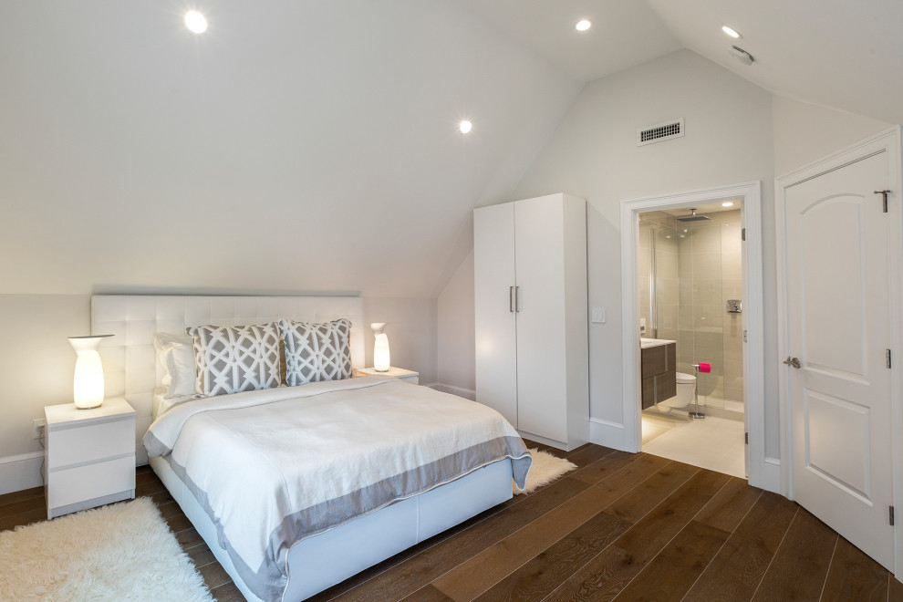 This is an example of a mid-sized modern master bedroom in Boston with white walls and dark hardwood floors.