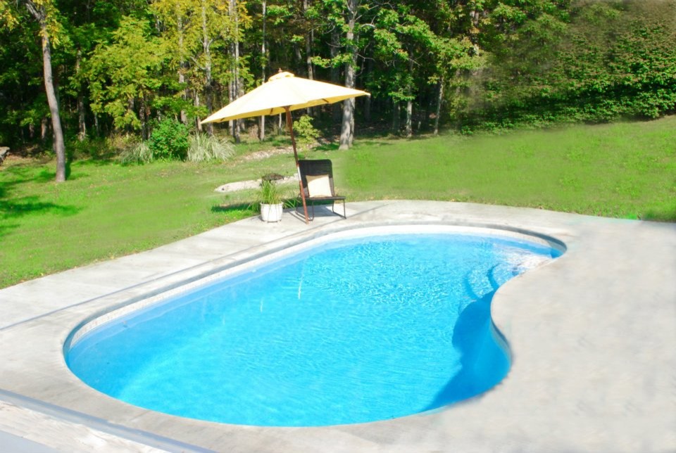 Inspiration for a mid-sized backyard custom-shaped pool remodel in Indianapolis