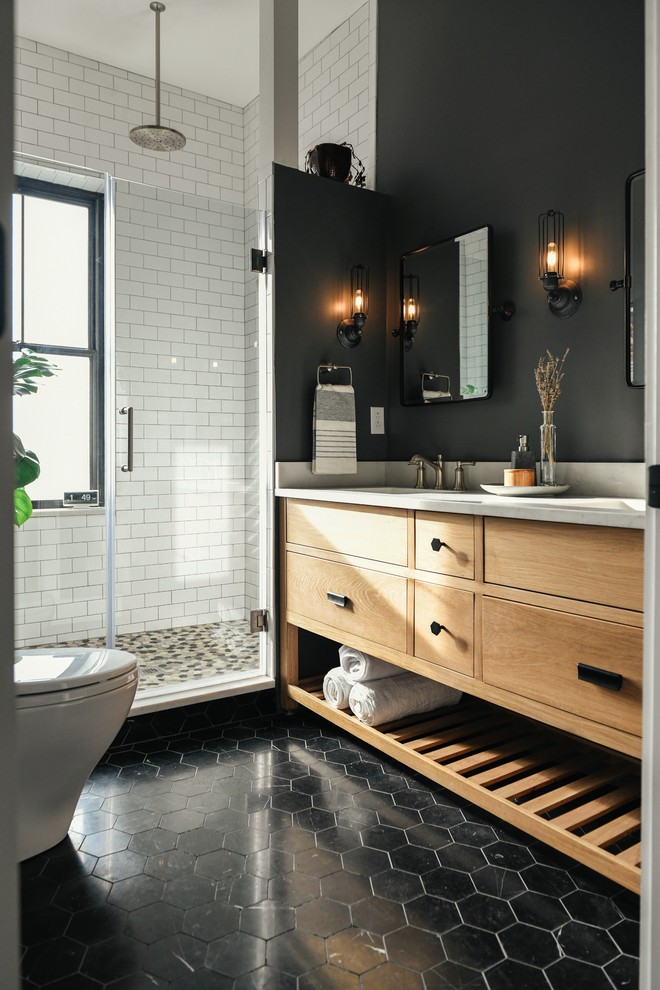 Small transitional master bathroom in Other with light wood cabinets, an open shower, a two-piece toilet, white tile, subway tile, marble floors, an undermount sink, engineered quartz benchtops, black floor, a hinged shower door, white benchtops and flat-panel cabinets.