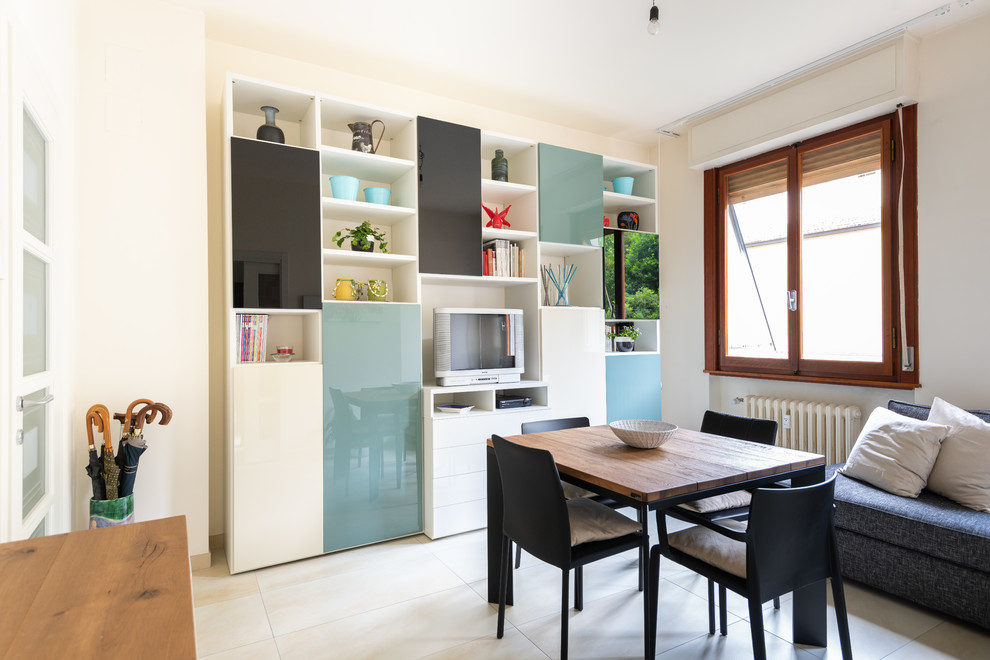 This is an example of a mid-sized modern kitchen/dining combo in Florence with white walls, porcelain floors and beige floor.