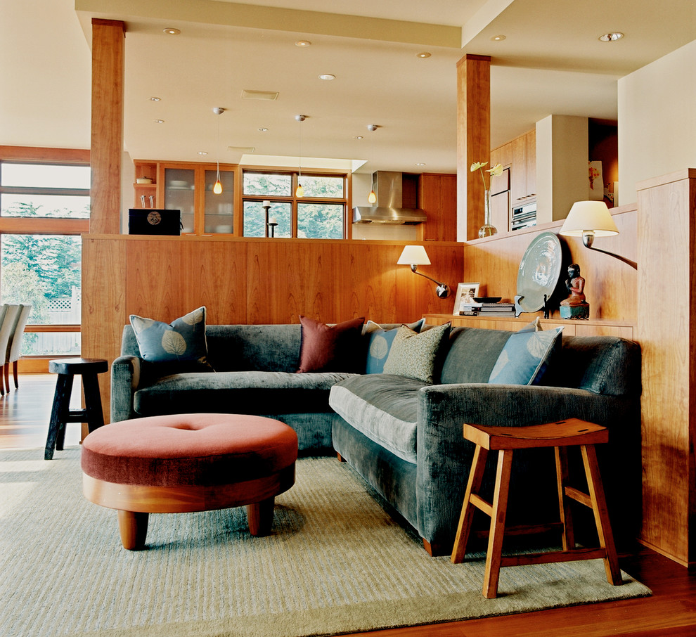 Contemporary open concept family room in Seattle with beige walls.