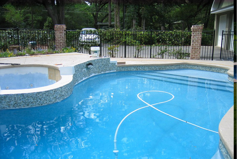 Inspiration for a large transitional backyard pool remodel in Miami
