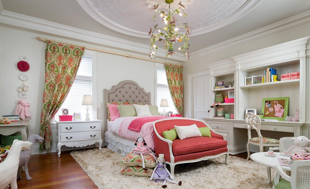 Traditional kids' bedroom in Toronto with medium hardwood floors and beige walls for kids 4-10 years old and girls.