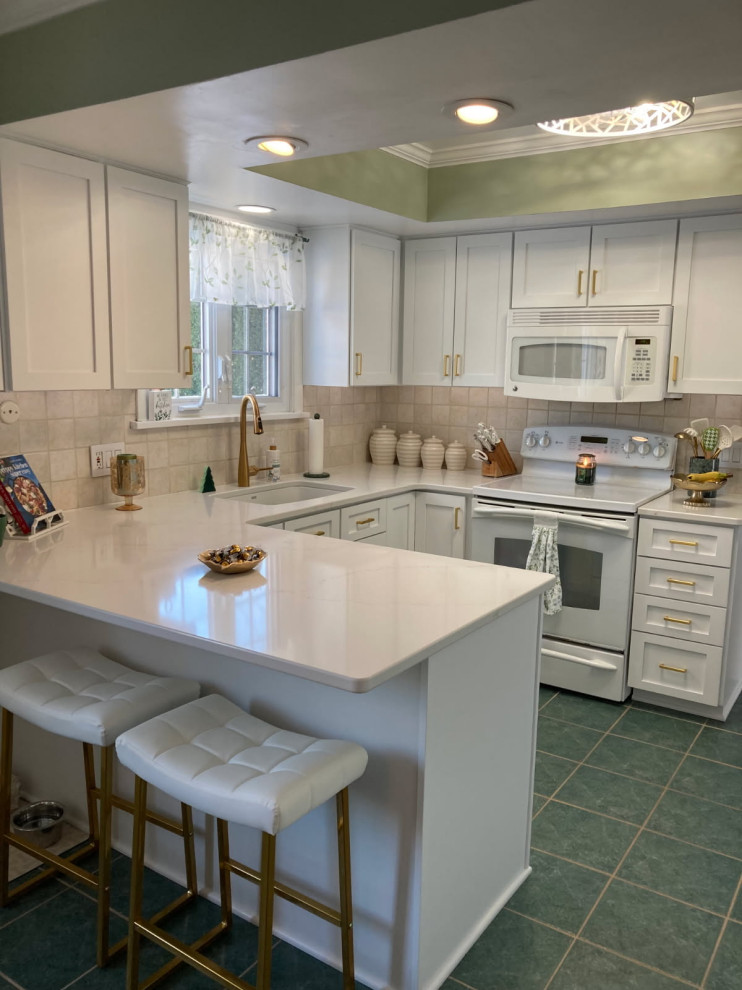 Inspiration for a mid-sized transitional u-shaped enclosed kitchen remodel with shaker cabinets, white cabinets and quartz countertops