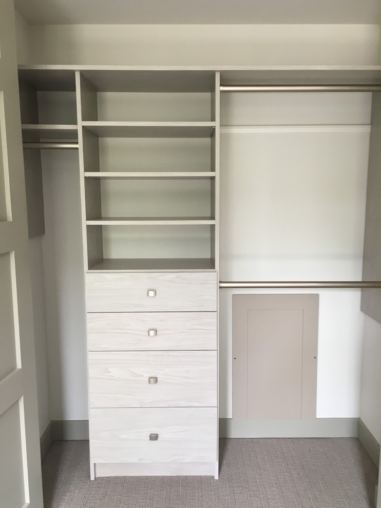 Mid-sized transitional gender-neutral carpeted and gray floor walk-in closet photo in Denver with flat-panel cabinets and white cabinets