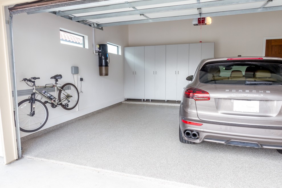 Design ideas for a mid-sized industrial attached two-car garage in Houston.