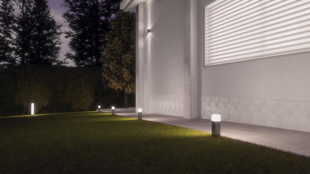 Foto di un grande giardino formale contemporaneo esposto a mezz'ombra davanti casa in primavera con un ingresso o sentiero e pavimentazioni in mattoni