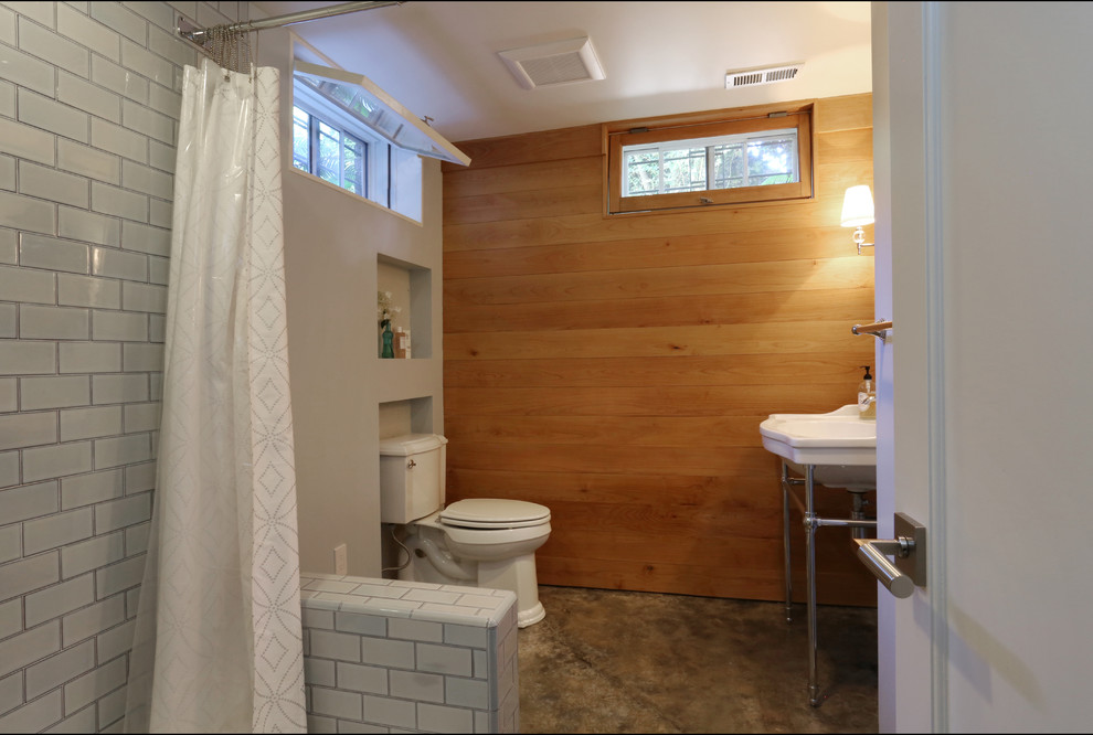 This is an example of a large traditional 3/4 bathroom in Portland with a console sink, blue tile, ceramic tile, grey walls and concrete floors.