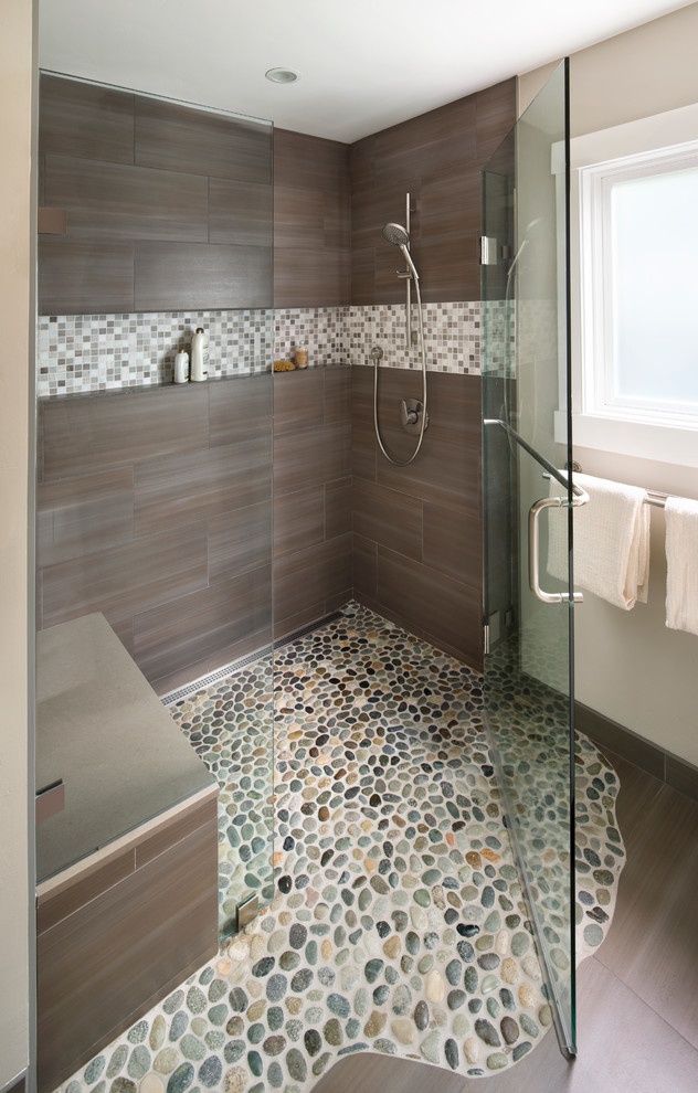 Photo of a contemporary master bathroom in San Francisco with shaker cabinets, white cabinets, a curbless shower, a wall-mount toilet, multi-coloured tile, mosaic tile, porcelain floors, an undermount sink and engineered quartz benchtops.