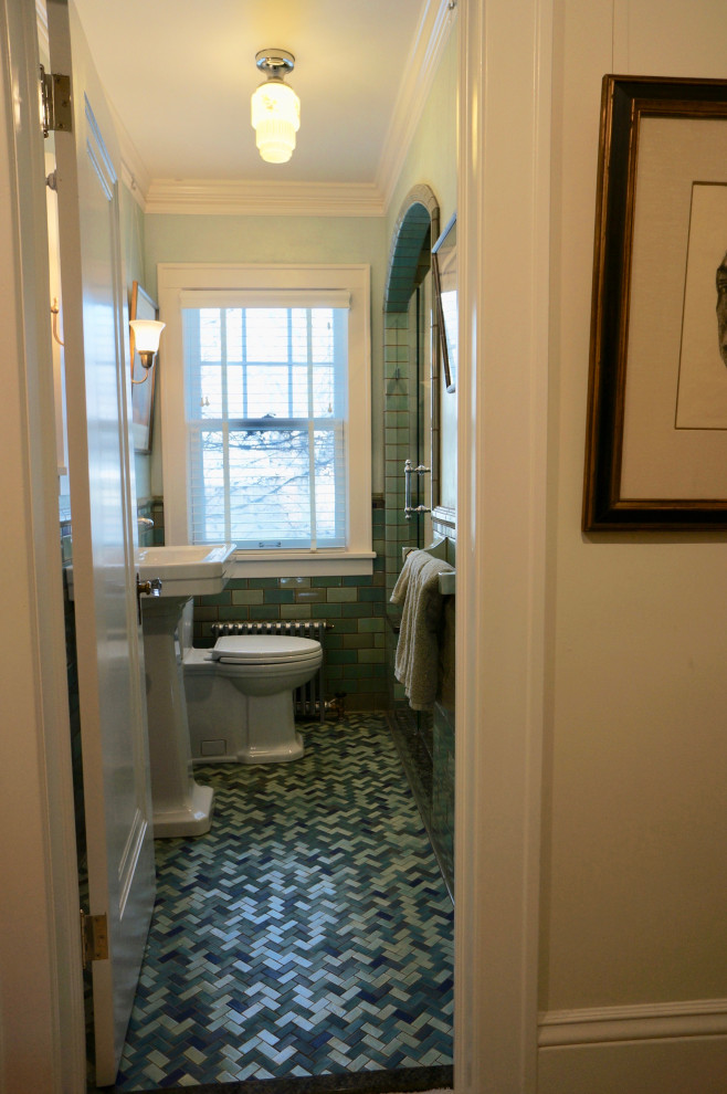 Design ideas for a small traditional 3/4 bathroom in Minneapolis with an alcove shower, blue tile, ceramic tile, blue walls, ceramic floors, green floor, a shower seat, a single vanity, a freestanding vanity, a one-piece toilet, a pedestal sink and a hinged shower door.