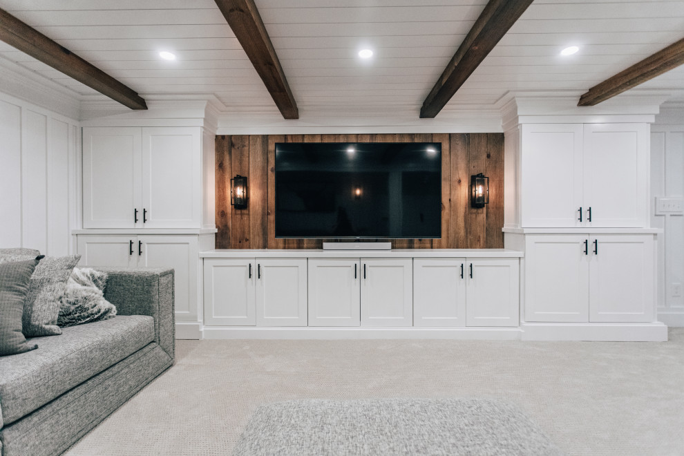 This is an example of a mid-sized country fully buried basement in Minneapolis with a home bar, white walls, carpet, grey floor, wood and panelled walls.
