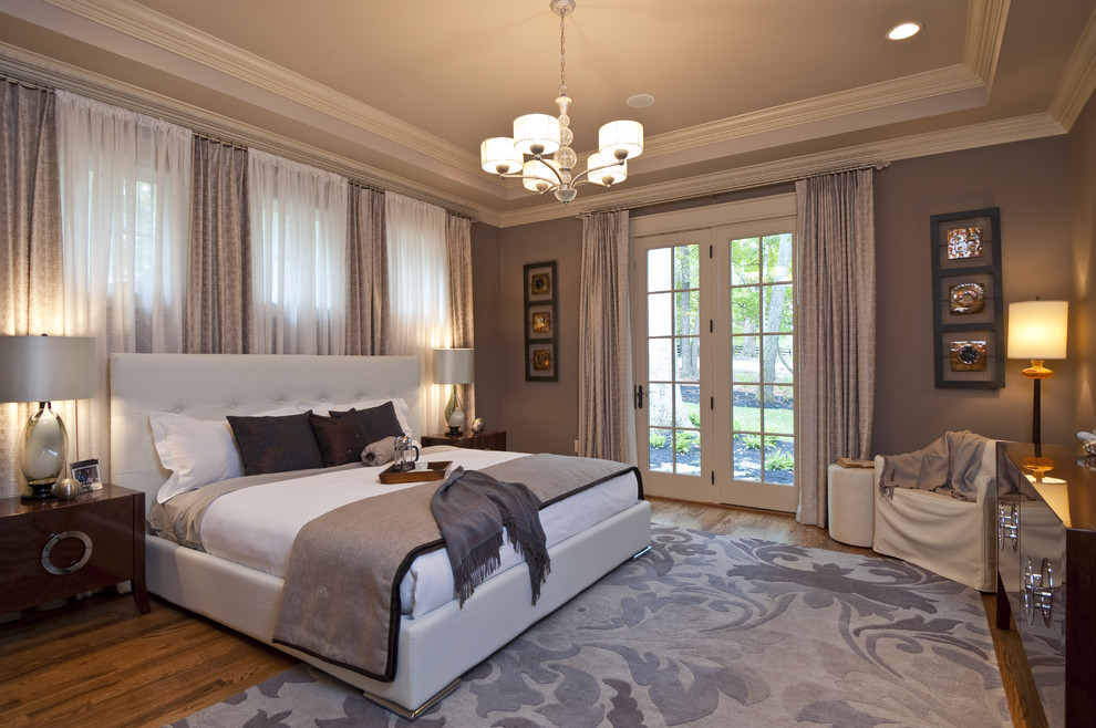 Inspiration for a contemporary bedroom in Other with grey walls and medium hardwood floors.