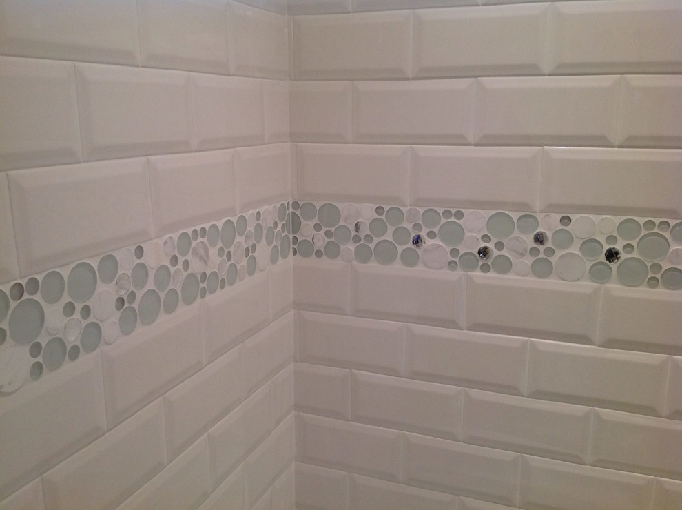 Mid-sized transitional multicolored tile and subway tile marble floor alcove bathtub photo with an undermount sink, recessed-panel cabinets, gray cabinets, quartz countertops, a one-piece toilet and gray walls