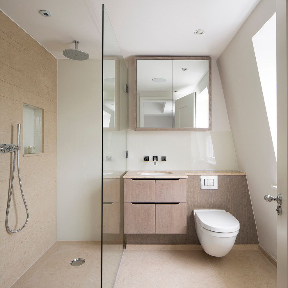 Inspiration for a modern 3/4 bathroom in London with flat-panel cabinets, light wood cabinets, an alcove shower, a wall-mount toilet, beige tile, white walls, an undermount sink and an open shower.