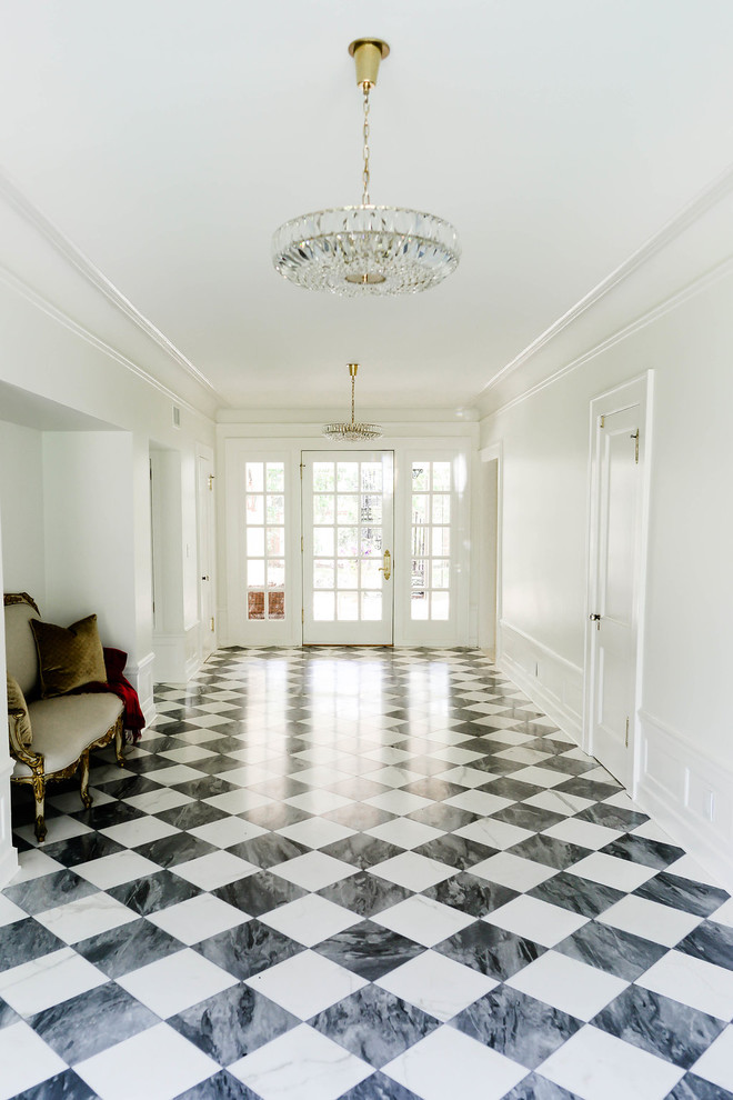 Design ideas for a large traditional hallway in Tampa with white walls, marble floors and multi-coloured floor.