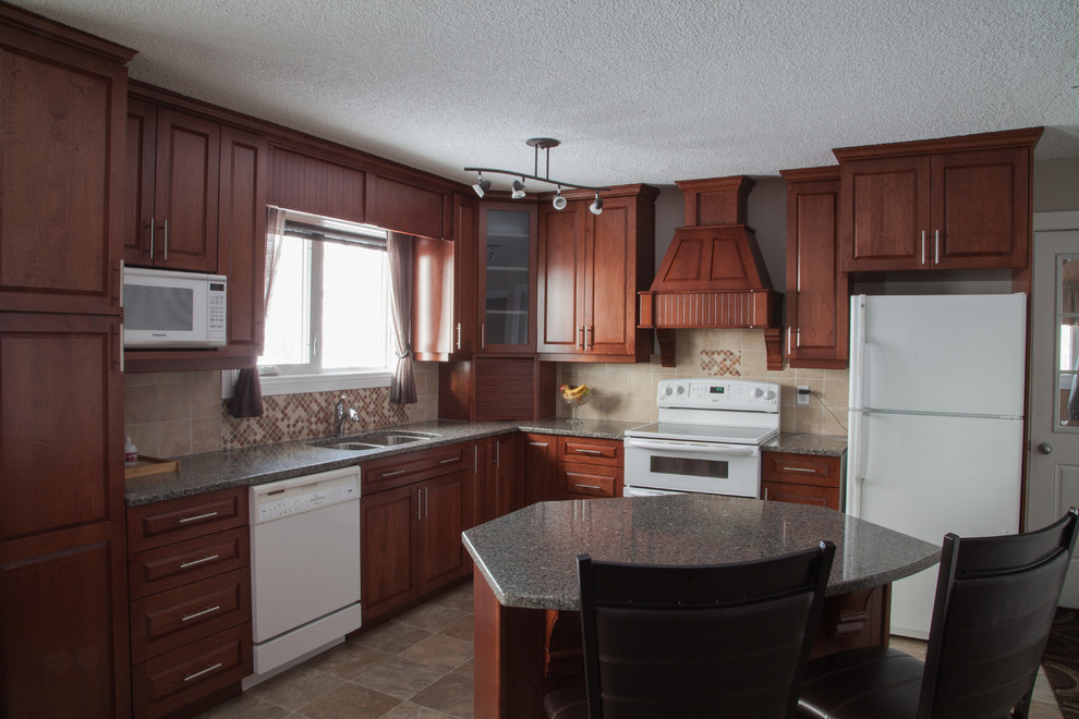 Eat-in kitchen - mid-sized traditional l-shaped vinyl floor and gray floor eat-in kitchen idea with an undermount sink, raised-panel cabinets, medium tone wood cabinets, quartz countertops, beige backsplash, white appliances, an island and ceramic backsplash