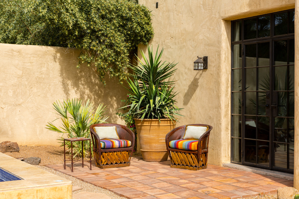 Patio fountain - small southwestern backyard brick patio fountain idea in Phoenix with no cover