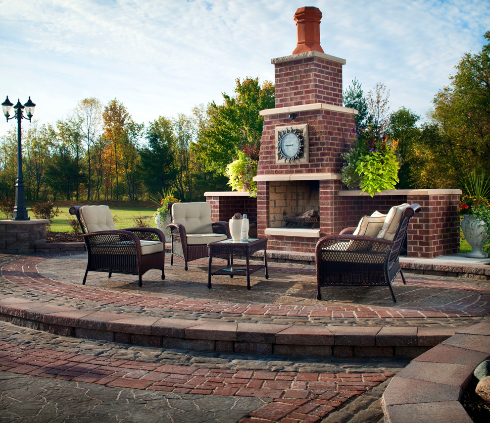 Patio - traditional backyard stone patio idea in Bridgeport with a fire pit and no cover