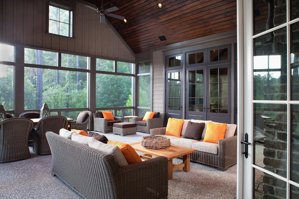 Inspiration for a mid-sized timeless concrete back porch remodel in Charleston with a roof extension