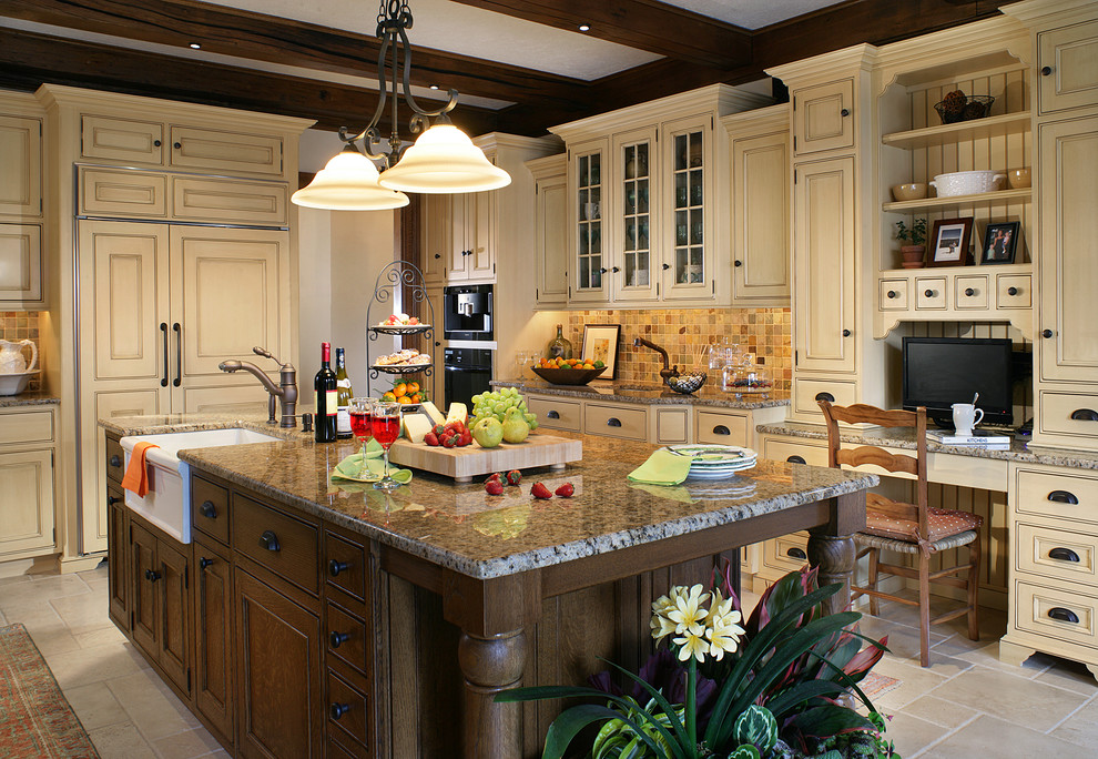 This is an example of a large traditional u-shaped eat-in kitchen in New York with a farmhouse sink, beaded inset cabinets, yellow cabinets, granite benchtops, multi-coloured splashback, slate splashback, panelled appliances, limestone floors, with island, yellow floor and brown benchtop.