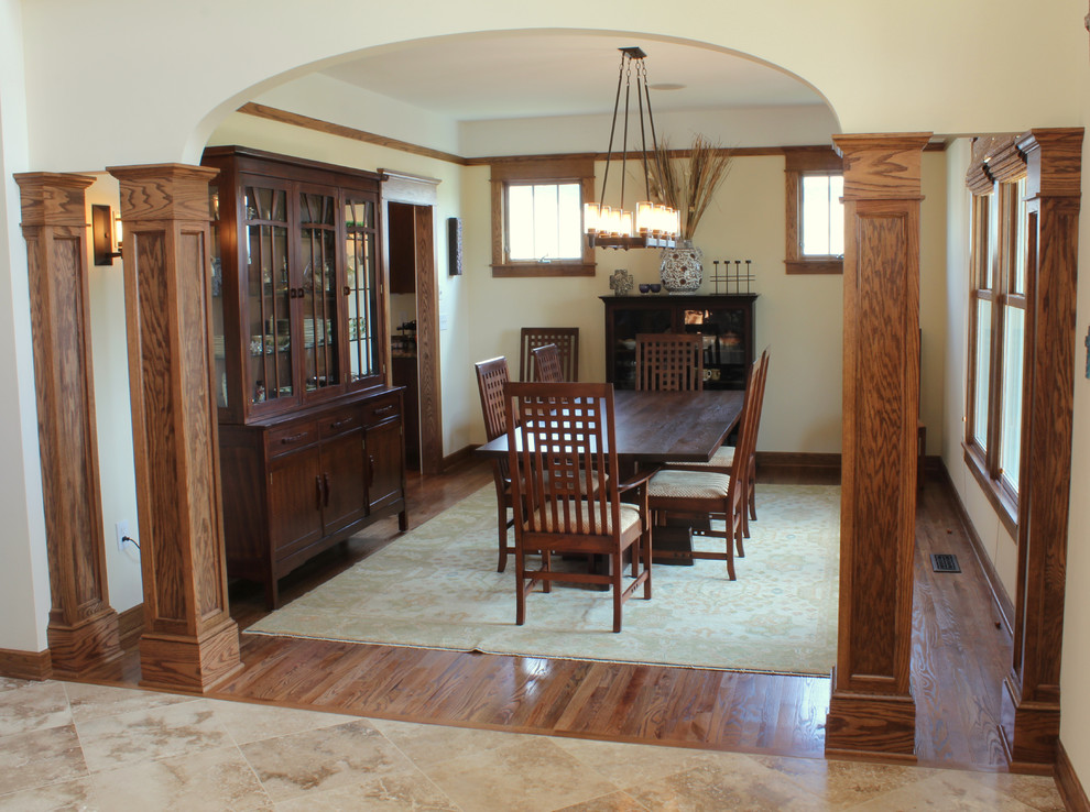 Inspiration for a traditional dining room in Other with medium hardwood floors, no fireplace and yellow walls.