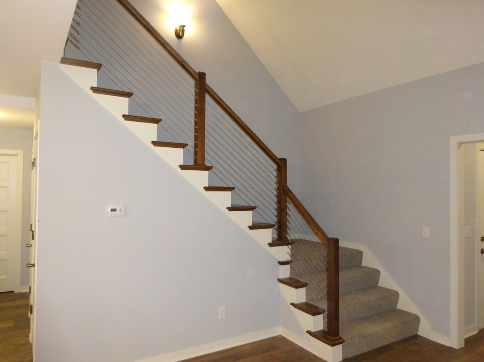 Mid-sized transitional carpeted l-shaped staircase photo in Milwaukee with carpeted risers